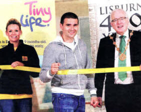 The Mayor of Lisburn, Councillor Allan Ewart promotes TinyLife as the official charity of the 2010 Coca-Cola Lisburn Half Marathon, 10K Road Race and 3K Fun Run.Pictured with the Mayor is (r-I) Mr David Healy MBE, patron of TinyLife, who practises passing the finishing line and Mrs Samara Prentice, Events Officer for Tinylife.