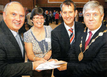 Rev Brian Anderson and Jane Dawson, from Seymour Street Methodist Church, with Health Minister Edwin Poots and Lisburn Mayor Brian Heading at the launch of the church's Damask community outreach program. The project will offer a number of activities including health advice, a parent and toddler group and computer training. US3911-515cd 