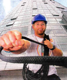 Ulster Rugby player Darren Cave gears up to launch an abseil event at The Obel - Ireland's largest skyscraper
