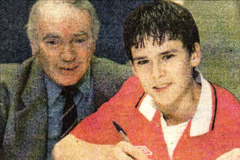 Eddie with 14-year-old David Healy when he signed for Manchester United from Lisburn Youth.
