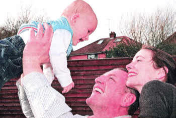 Stephen and Karen Willoughby with their seven month old son Darragh back home in Belfast after leaving Libya last week.
