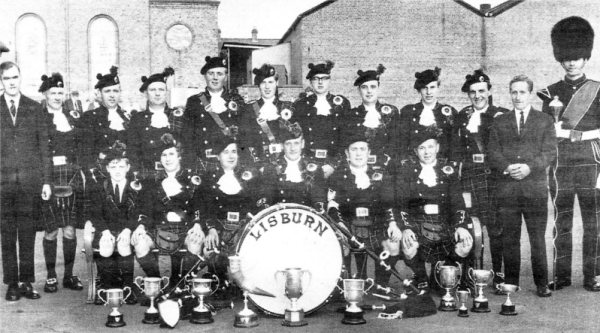 Lisburn Pipe Band in 1968 after being crowned 'Champion of Champions'. President Stan Coates (in suit on right). Seated behind the drum is Secretary Jim Reilly and to his left is Pipe Major Bobby Brannigan.