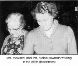Mrs. McAllister and Mrs. Mabel Bowman working in the cloth department