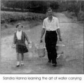 Sandra Hanna learning the art of water carrying 