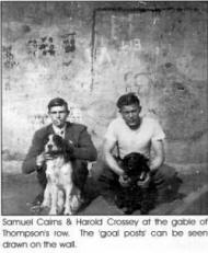 Samuel Cairns & Harold Crossey at the gable of Thompson's row. The 'goal posts' can be seen drawn on the wall.
