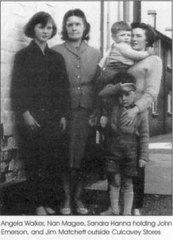 Angela Walker, Nan Magee, Sandra Hanna holding John Emerson, and Jim Matchett outside Culcavey Stores