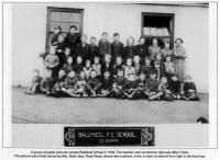 A group of pupils pictured outside Ballykeel School in 1939. The teacher seen at extreme right was Miss Fulton. The picture was kindly loaned by Mrs. Belle Jess, Rock Road, whose late husband, Irvine, is seen at second from right in the front row.