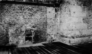Fig. 7. The north west corner of the market house, uncovered in 1985, showing the red sandstone front of the building and the 18th century brickwork of the adjoining house. (Photograph Lisburn Museum, 1985).