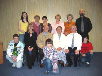 Leaders and some members of the congregation of Fresh Oil Church.  L to R:  (seated) Pastor Sheila Smyth, Robert Crockett, Martha Fulton and George Jackson with Paul Kinghan (left), Nathan Smyth (front) and Alan Alexander (right).  (back row) Rebekah Smyth, Caroline Wilson, Sharon Brown, Winifred Jackson, Dorothy Bell and Sam Alexander.