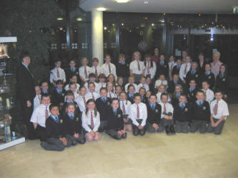 A combined choir from Fort Hill Primary School and St. Joseph’s Primary School who sang at the ‘Carols in the City’ concert in Lagan Valley Island on Wednesday 1st December 2004