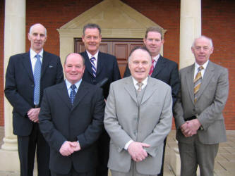 Lisburn Free Presbyterian Church ministers and elders.  L to R: (front) Rev. Thomas Martin - Minister, Dr. John Douglas - Senior Minister.  (back row) Elders: Samuel Norton, Eric Graham - Clerk of Session, Noel Thompson and Samuel Collins.  Missing from the photo:  Danny Mannagh and James Anderson.