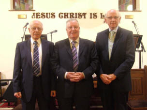Church Leadership assisting the Pastor L to R: Roy Irwin (Elder) Reamond Hyde (Deacon) John McGowan (Elder).
