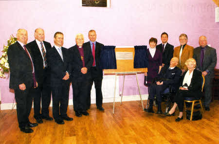 Left to Right(left hand side of the plaque), Mr Michael Conroy, Mr Bill Davidson (Annvale Construction) Mr Gary McMurray (Rector's Church Warden), Rt. Rev Harold Miller (Bishop of Down and Dromore) Mr Mark Smith (Annvale Construction).On the right of the plaque Rev Joanne Megarrell (Rector of St John's, Moira), Mr Dennis Christie (People's Church Warden), Mr Ken Little (Rector's Glebe Warden) AND Mr Gerald Dillon (People's Glebe Warden). Front row seated Mr Derek Bateman and Mrs Gladys Bateman