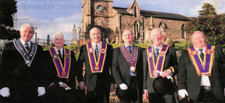 County and Grand Officers pictured against the backdrop of Magheragall Parish Church following the Co Antrim Grand RAPC Tri-Annual Service.