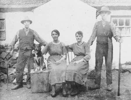 A family photographed in the Rushyhill area in the early 20th century. One of the females in this family was responsible for adorning the doors and windows of the homestead on May eve with Mayflowers to ward off the witches.