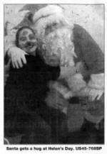 Santa gets a hug at Helen's Day. US45-768SP