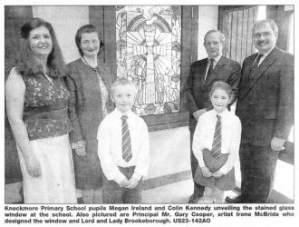 Knockmore Primary School pupils Megan Ireland and Colin Kennedy unveiling the stained glass window at the school. Also pictured are Principal Mr. Gary Cooper, artist Irene McBride who designed the window and Lord and Lady Brookeborough. US23-142AO