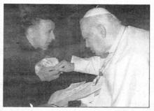 RIGHT: Father Rogan during a recent meeting with the late Pope. US14725SP