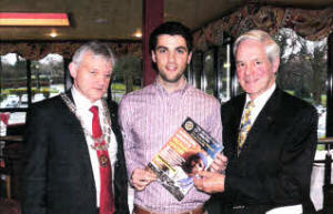 Gareth Patterson, centre, who returned to the Rotary Club of Lisburn to help them launch the 2012 bursary with president Dale Orr, left, and bursary organiser Stephen Gilbert.