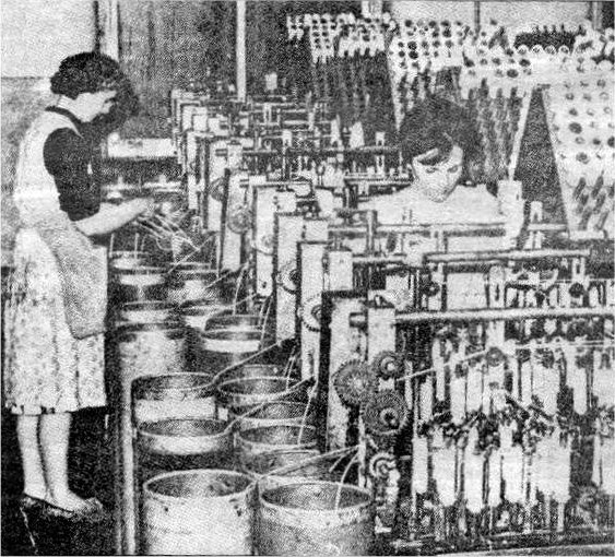 Lisburn's traditional industry was linen and this photograph shows two operators at work in Stewart's Mill.